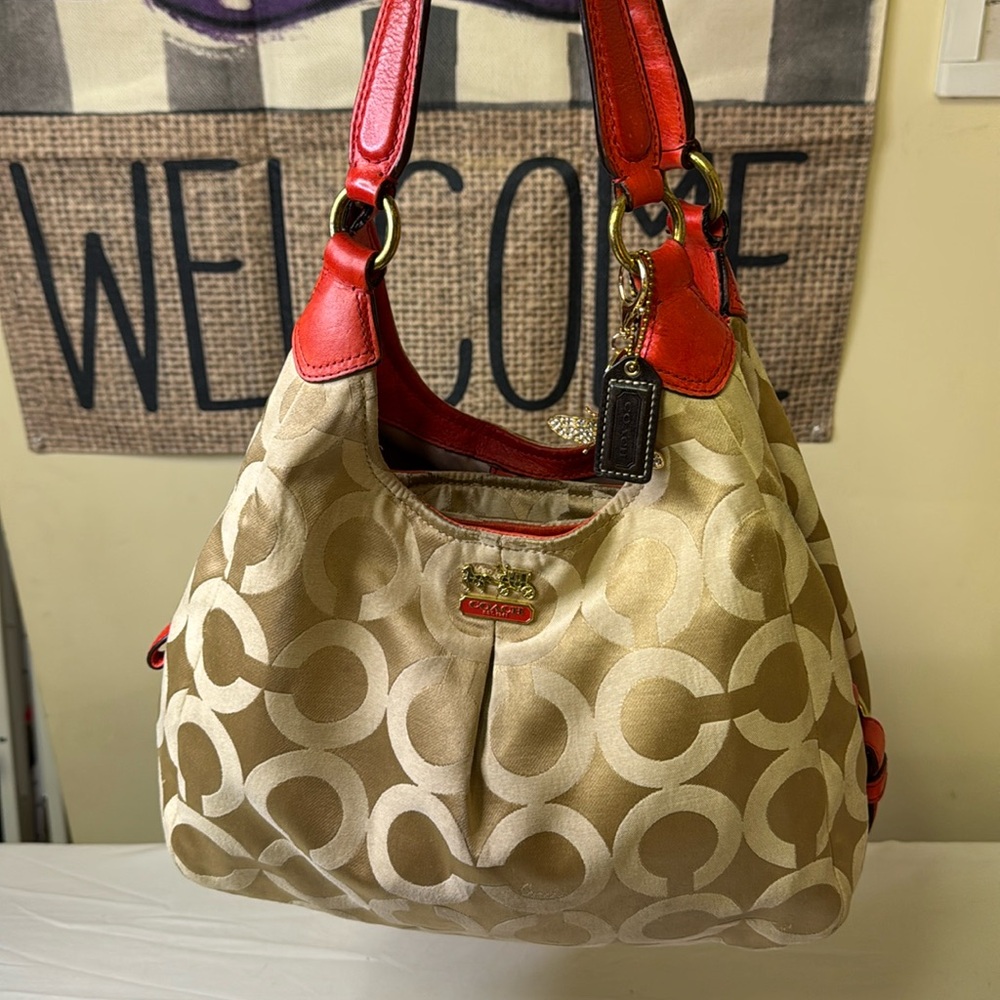 Coach Tan and Orange Signature Monogram Bag featuring Carriage logo on front.